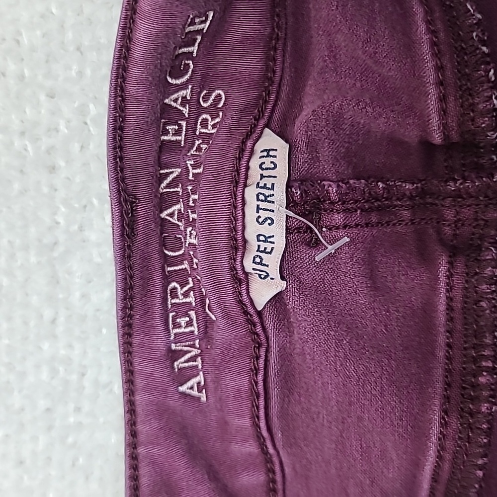 AE Next Level Low Rise Cuffed Raw Hem Cotton Denim Shortie Shorts in Burgundy - Picture 12 of 17